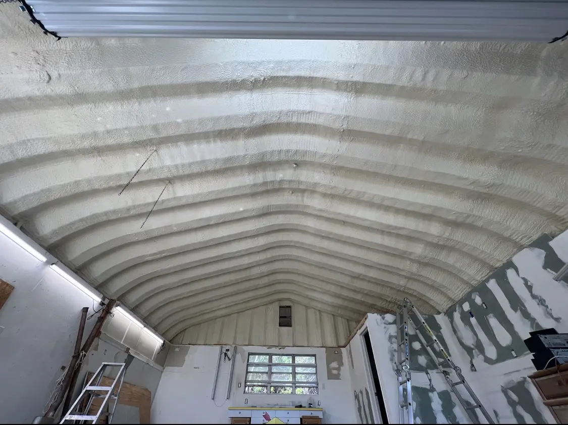 Spray polyurethane foam applied to the underside of a metal roof deck in Rocky Mount